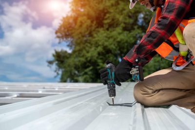 professional installing new roof in commercial property - TurnKey Roofing Team