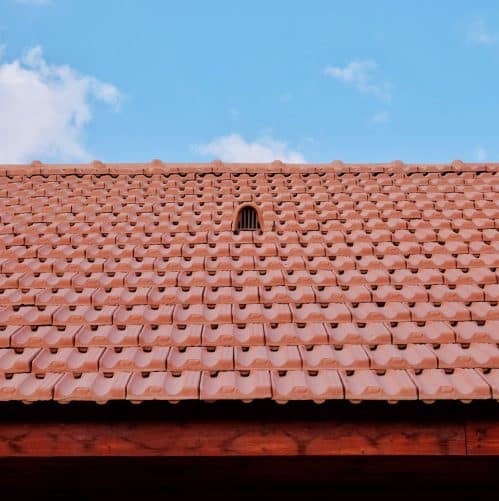 Close-up of a ridge vent installed along a shingle roofline