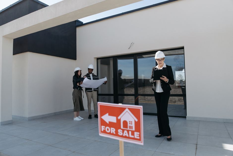 Homeowner reviewing a written roof estimate with a contractor