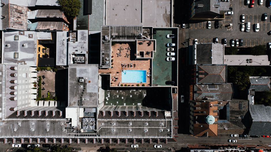 Row of New Orleans homes showing varied roof colors
