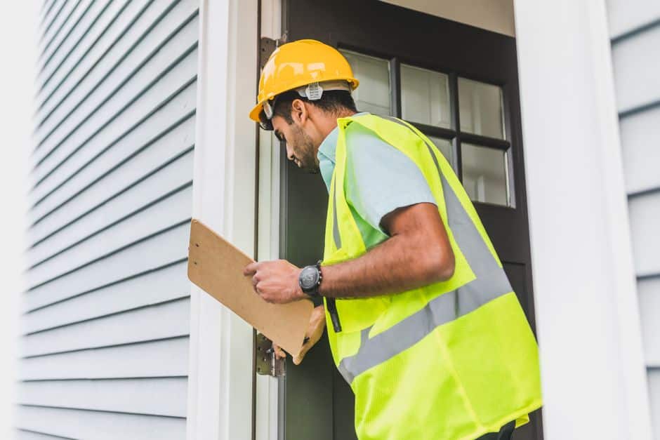 Homebuyer reviewing an inspection report about roof condition